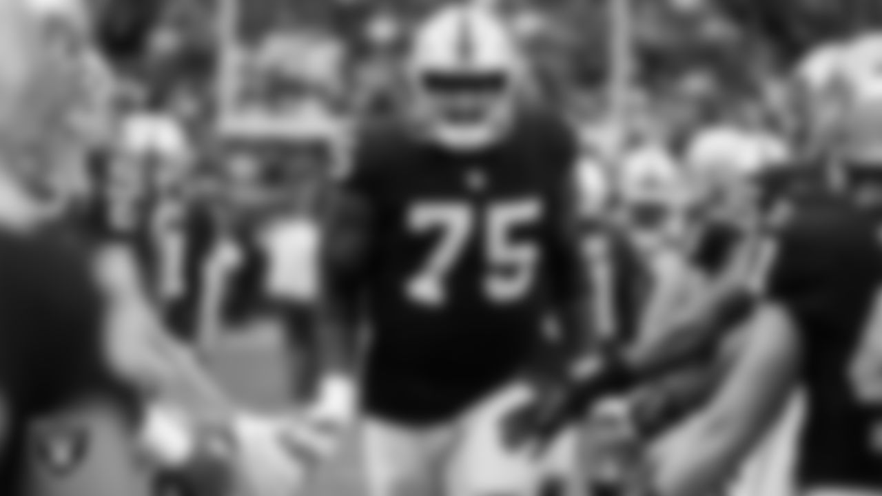 Las Vegas Raiders tackle Brandon Parker (75) is introduced onto the field before the regular season home game against the Washington Football Team.