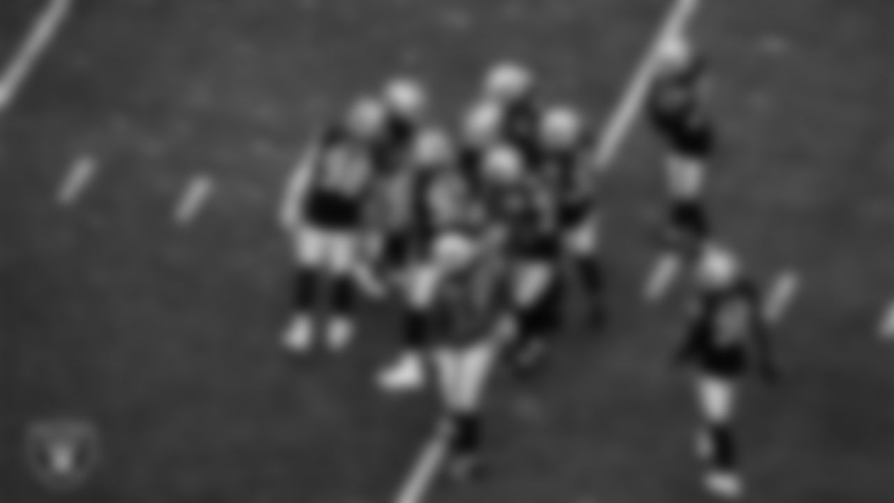 The Las Vegas Raiders defense huddles during the regular season home game against the Cincinnati Bengals.