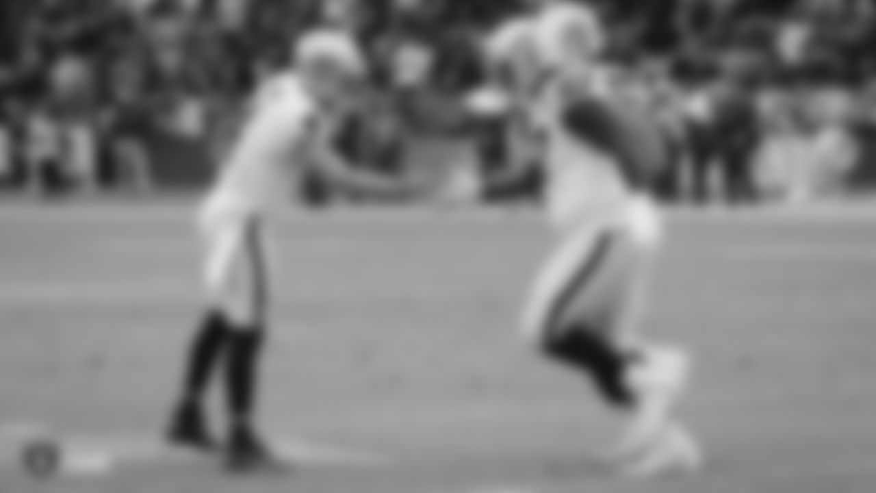 Raiders quarterback Derek Carr (4) and guard Lester Cotton Sr. (67) during the regular season game against the Los Angeles Chargers at ROKiT Field at Dignity Health Sports Park.