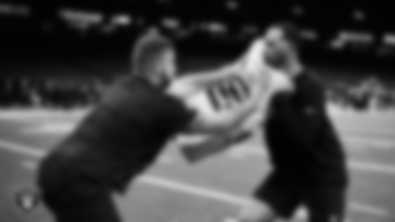 Las Vegas Raiders guard Alex Bars (64) and assistant offensive line coach Cameron Clemmons warming up before the regular season away game against the New Orleans Saints at Caesars Superdome.