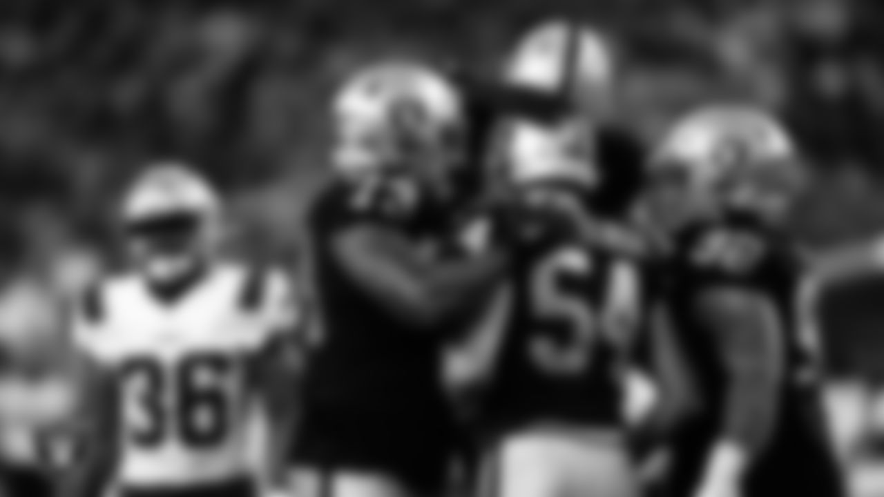 Las Vegas Raiders defensive end Zach VanValkenburg (54) celebrates with teammates after sacking the quarterback during the preseason home game against the New England Patriots at Allegiant Stadium.