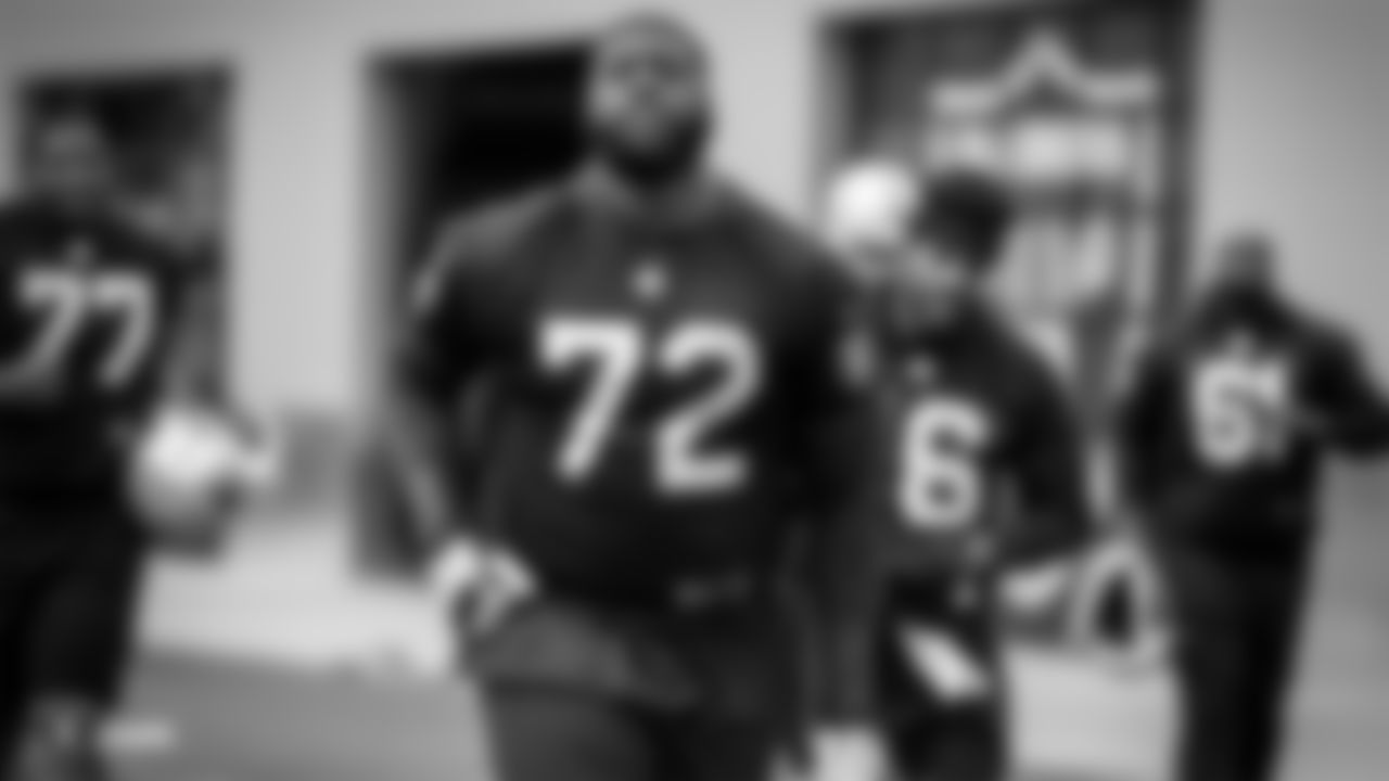 Raiders tackle David Sharpe (72) on the field for practice.