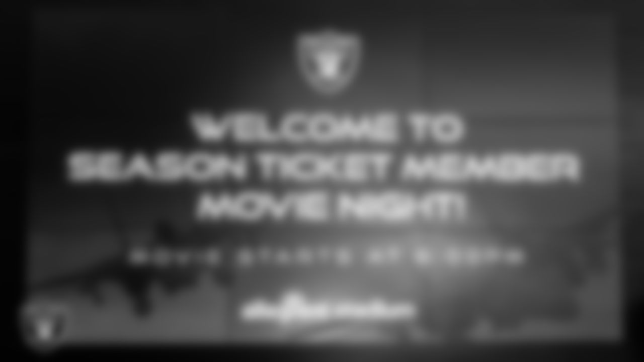A sign welcomes season ticket members to the screening of Top Gun: Maverick at Allegiant Stadium.