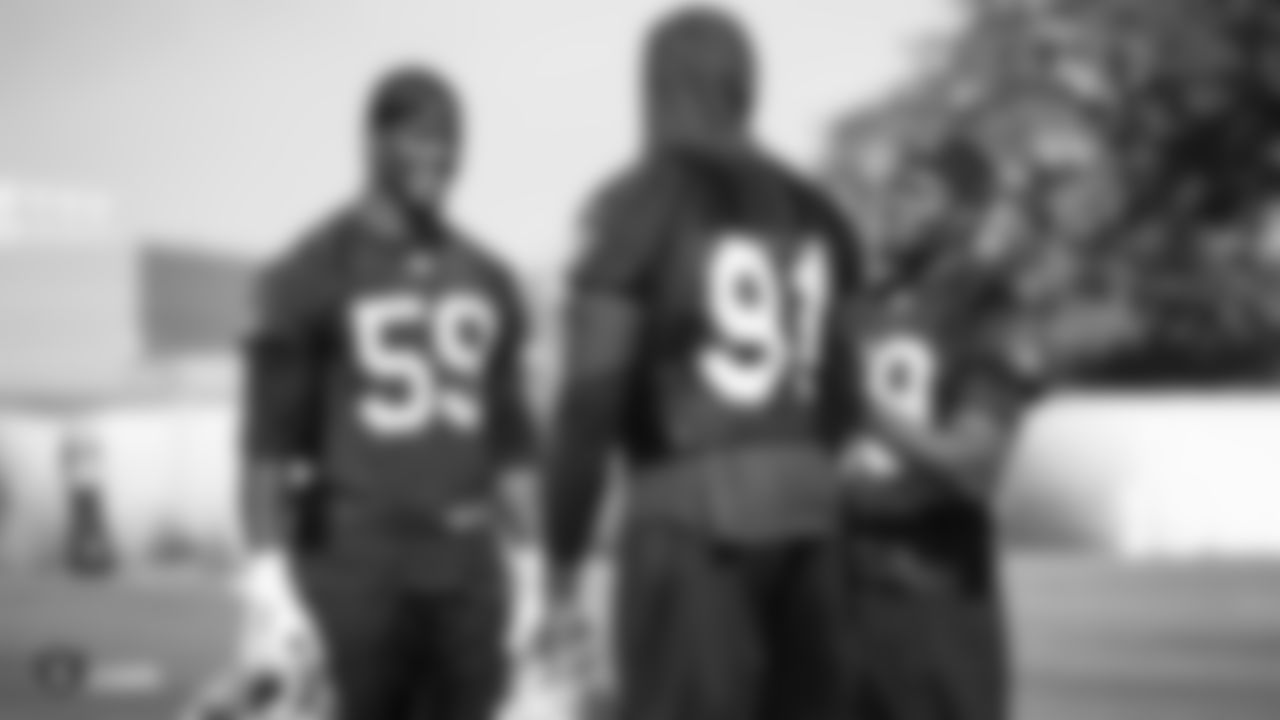 Raiders linebacker Tahir Whitehead (59) talks with safety Lamarcus Joyner (29) during practice at the Raiders Practice Facility.