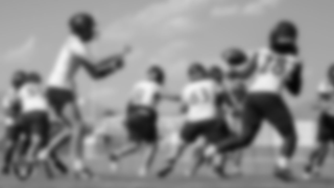 Members of the Arbor View High School football team go through a play during practice at Arbor View High School.