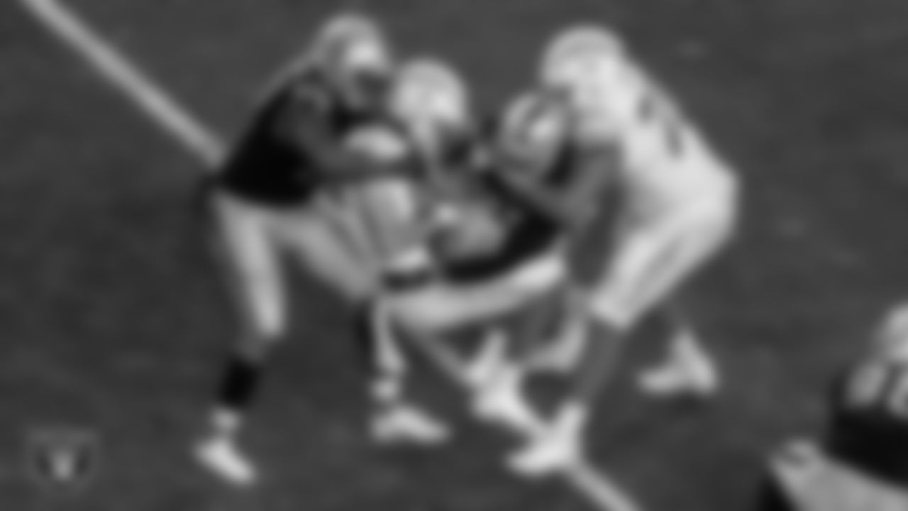 Las Vegas Raiders defensive tackle Quinton Jefferson (77) and defensive end Clelin Ferrell (99) sack the quarterback during the regular season home game against the Los Angeles Chargers.