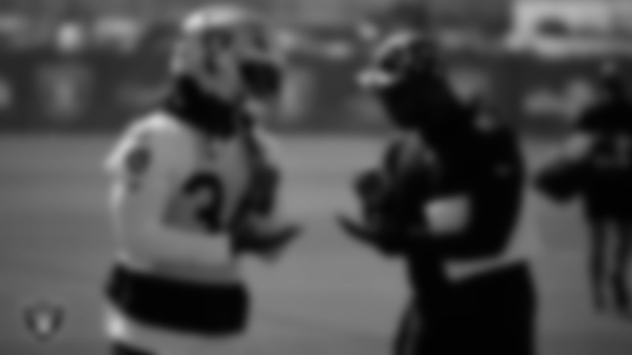 Las Vegas Raiders running back Brandon Bolden (34) and offensive assistant Fred Walker during practice at Intermountain Health Performance Center.