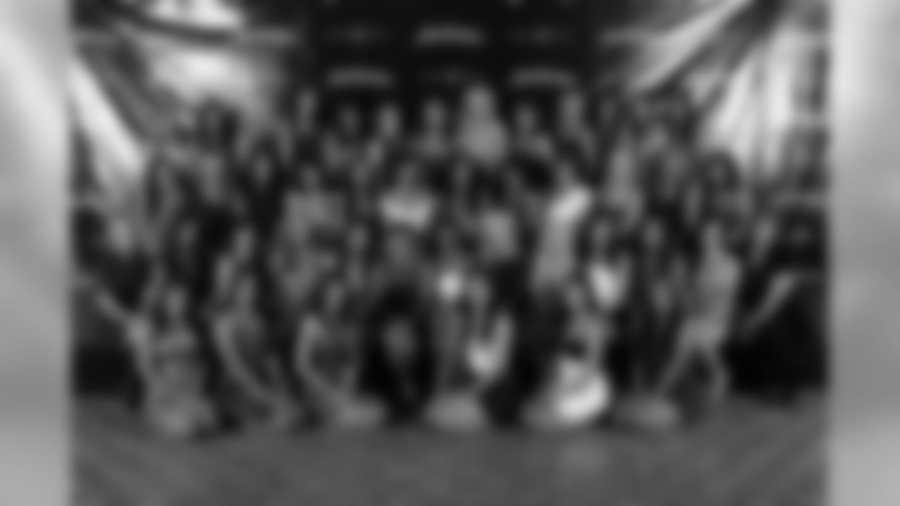 The 2011 Raiderettes take a group photo with Raiderette director Jeanette Thompson and choreographers Shawna Zimmerman and Laura Jollay. Photo by Tony Gonzales.