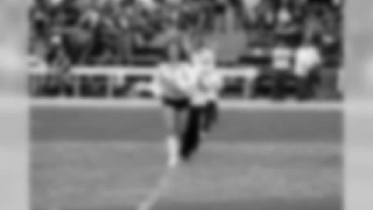 Raiderette Jennifer leads her line out on the field.