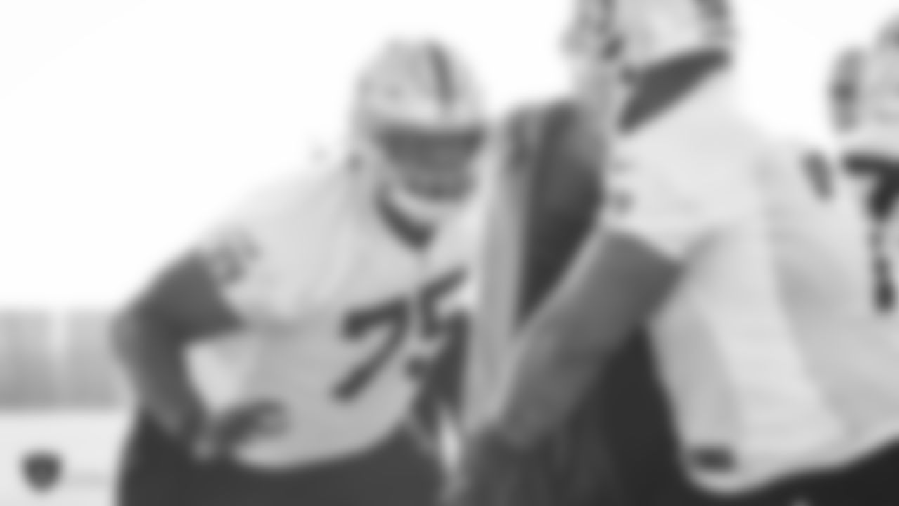 Raiders tackle Brandon Parker (75) goes through offensive drills during practice.