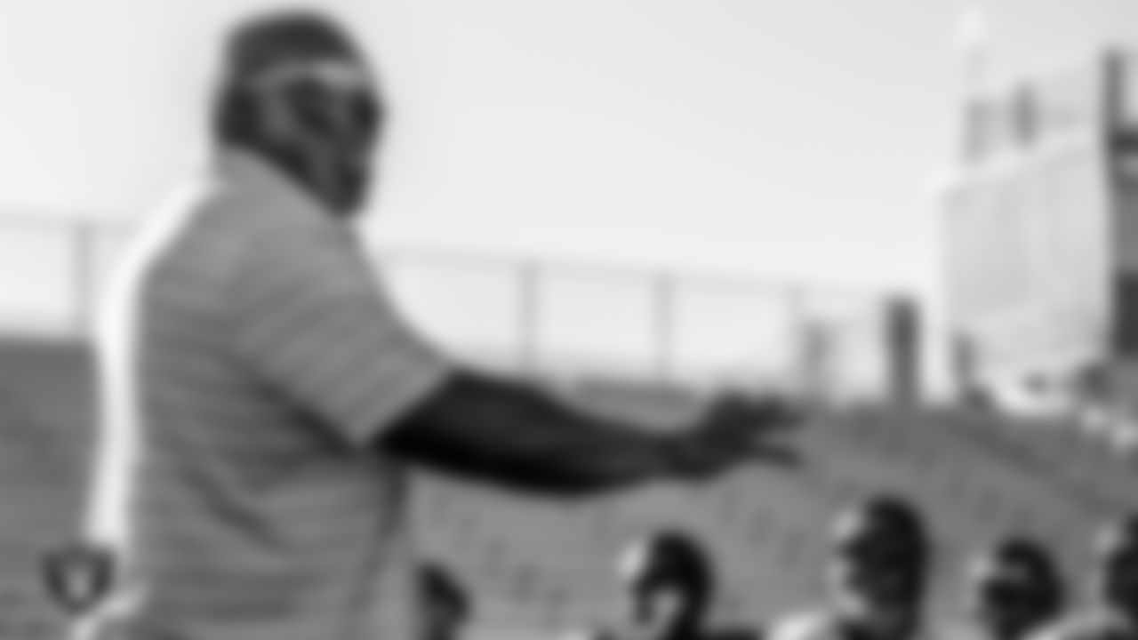 Las Vegas Raiders alumnus Roy Hart speaks to the Chaparral High School football team.