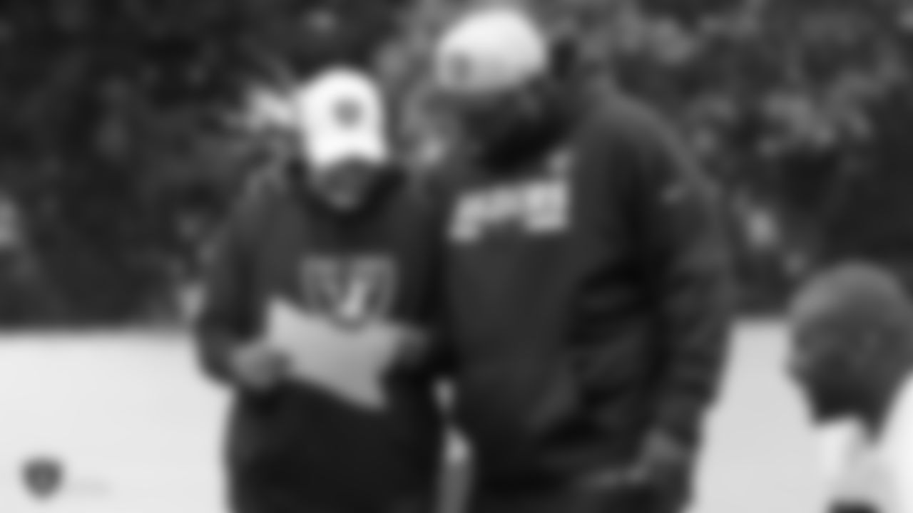 Raiders assistant head coach and special teams coordinator Rich Bisaccia and defensive line coach Brentson Buckner on the field for practice.