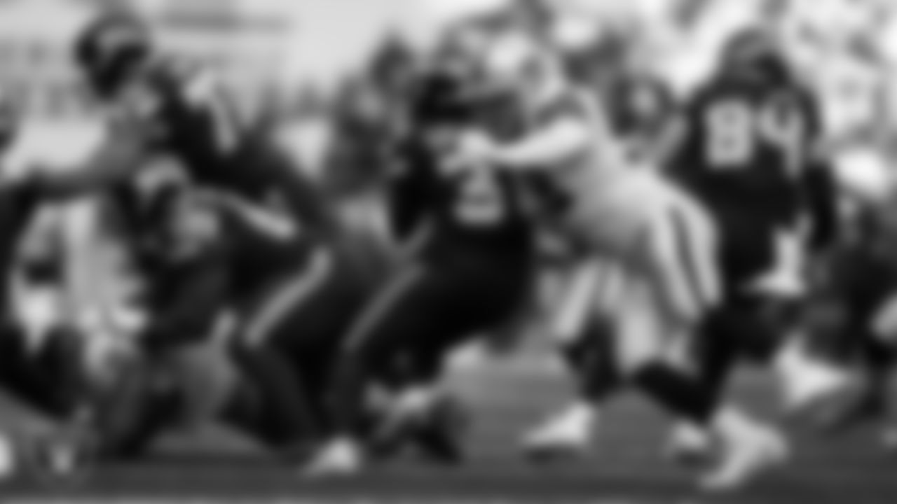 Las Vegas Raiders defensive end Maxx Crosby (98) makes a tackle during the regular season away game against the Seattle Seahawks at Lumen Field.