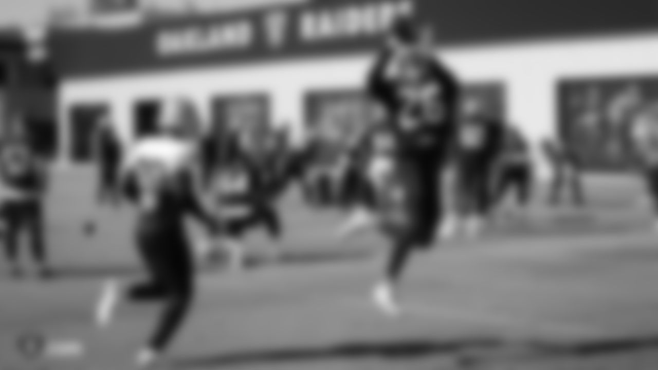 Raiders cornerback Nevin Lawson (26) goes up for a catch during practice.