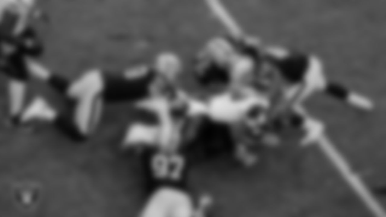 Las Vegas Raiders defensive tackle Damion Square (97), defensive end Maxx Crosby (98), defensive tackle Solomon Thomas (92) and linebacker Cory Littleton (42) during the regular season home game against the Cincinnati Bengals.