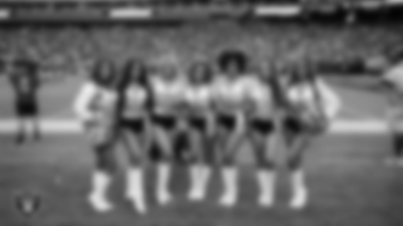 Raiderettes Katsura, Audrey, Jennifer, Madyson, Vicky, Bryana and Bree pose for a photo on the sidelines during the regular season home game against the Chicago Bears.