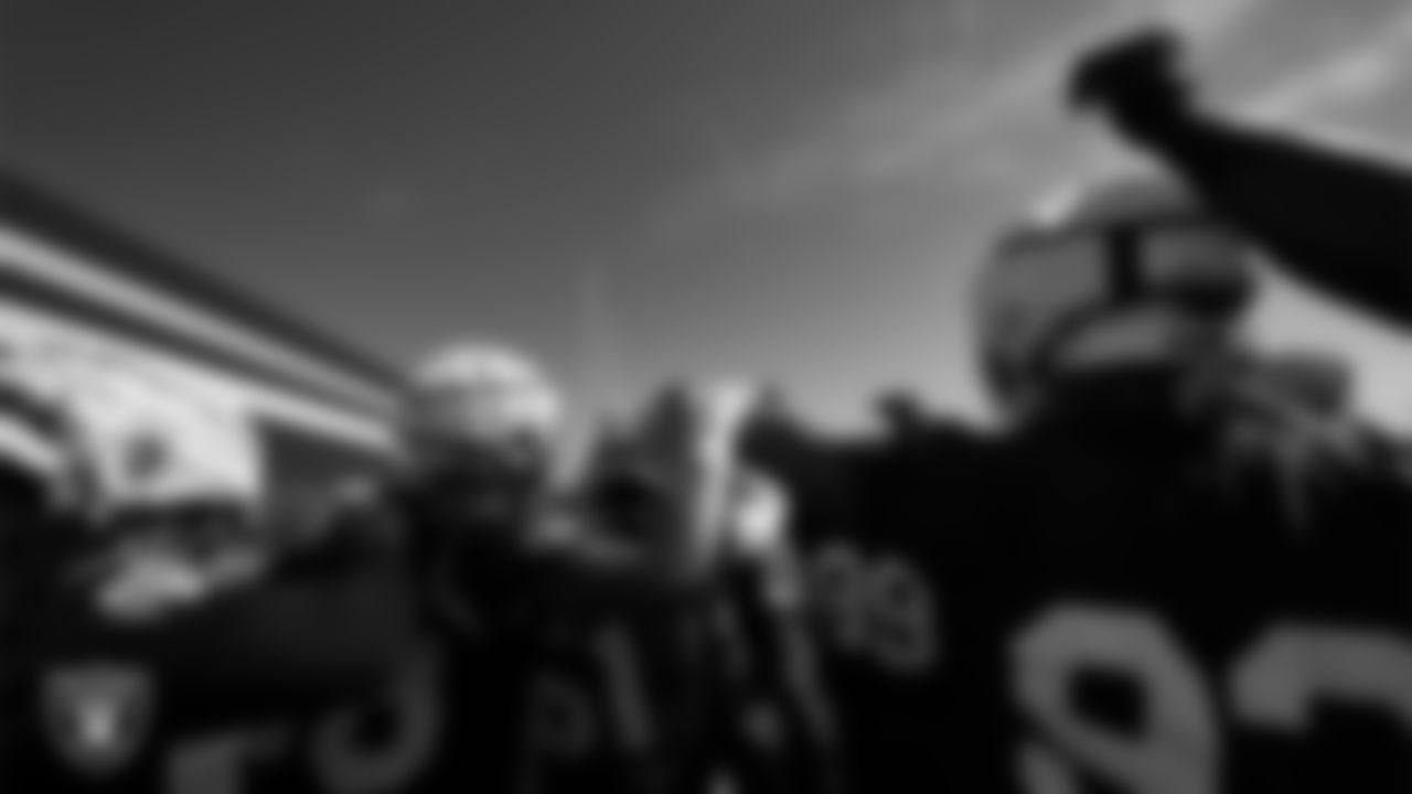 The Las Vegas Raiders huddle during practice at Intermountain Health Performance Center.