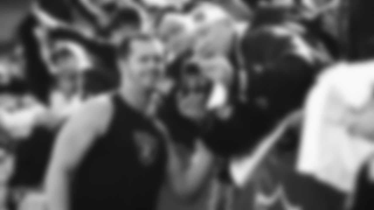 Raiders quarterback Derek Carr (4) takes a selfie with a fan before the regular season game against the Jacksonville Jaguars.