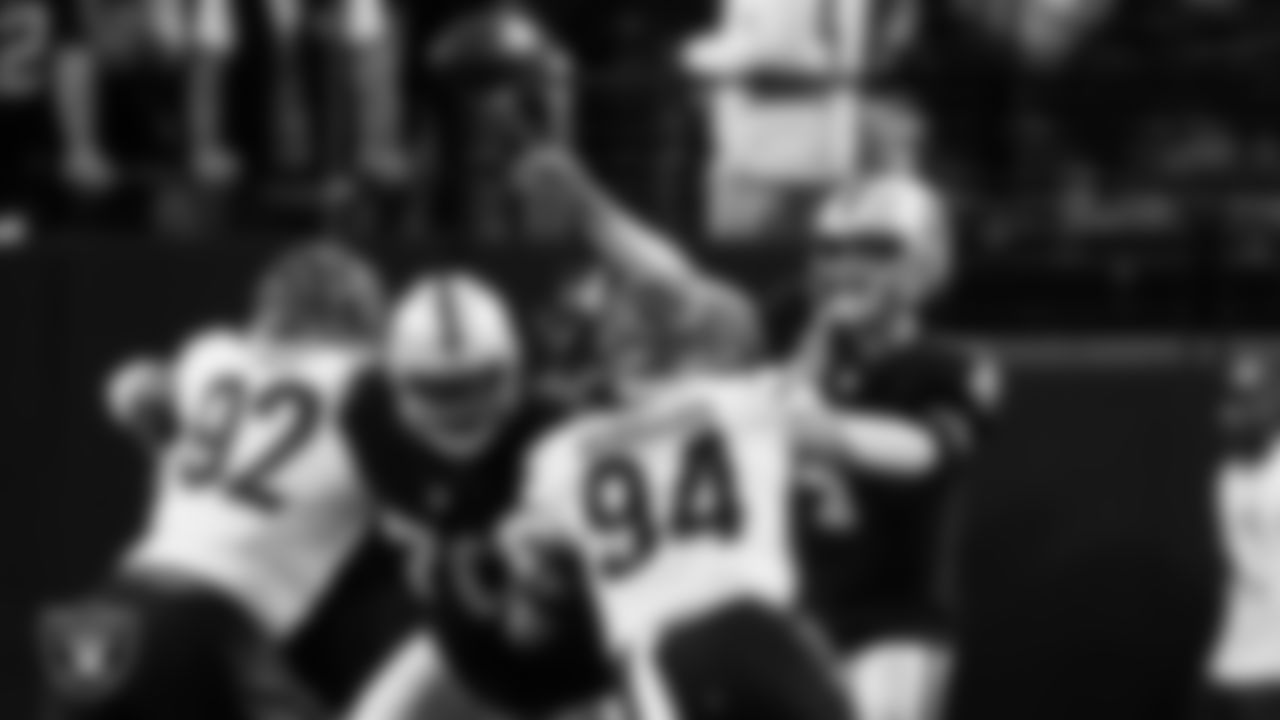 Las Vegas Raiders guard/tackle Alex Leatherwood (70) blocks as quarterback Derek Carr (4) passes during the regular season home game against the Cincinnati Bengals.