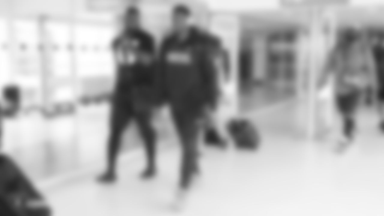 Oakland Raiders offensive guard Kelechi Osemele (70) and tight end Jared Cook (87) arrive at Heathrow Airport three days before their game against the Seattle Seahawks, Friday, October 12, 2018, in London, England.