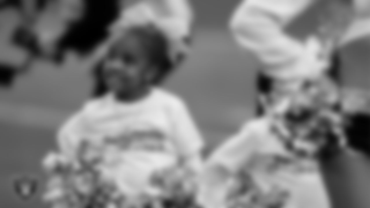 The Raiderettes and Junior Raiderettes perform on the field before the regular season home game against the Los Angeles Chargers at Allegiant Stadium.