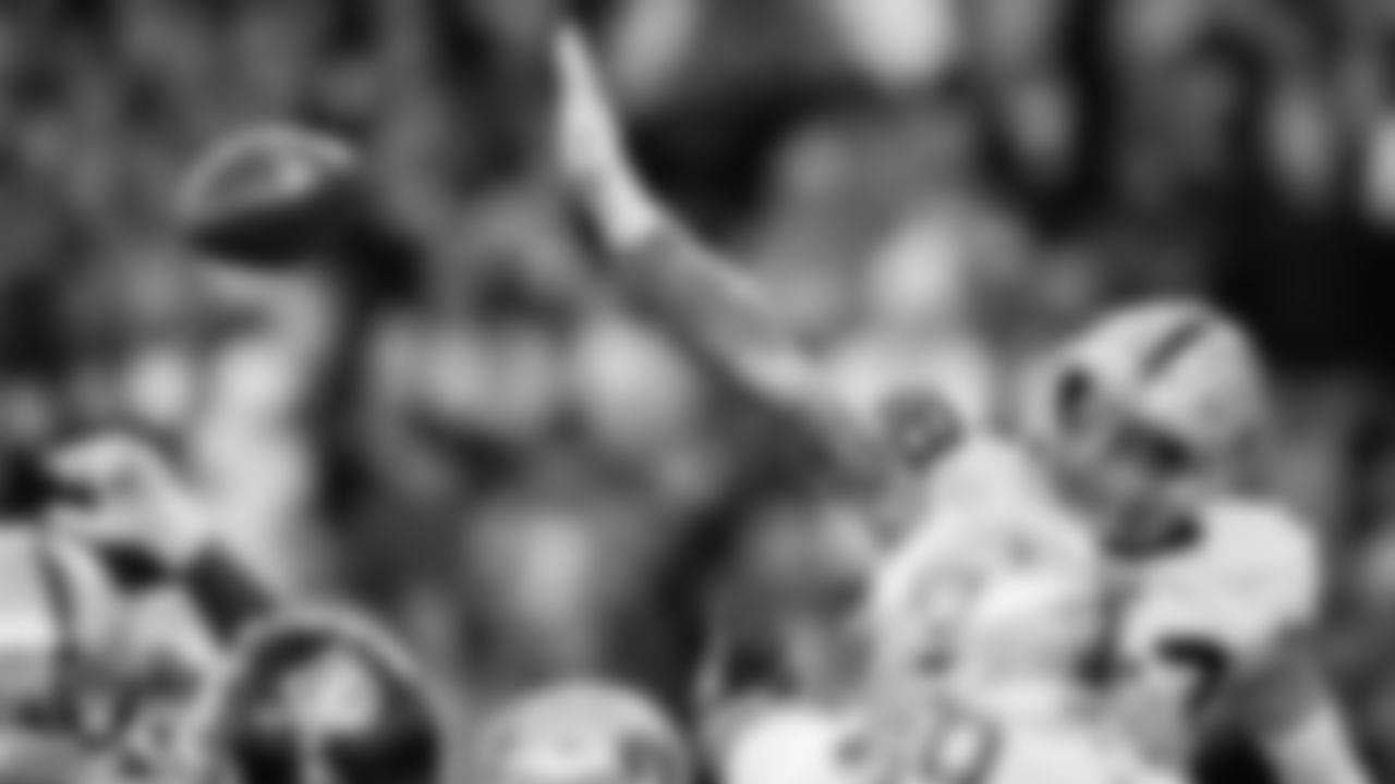 Las Vegas Raiders defensive end Maxx Crosby (98) blocks a field goal during the regular season away game against the Denver Broncos at Empower Field at Mile High.