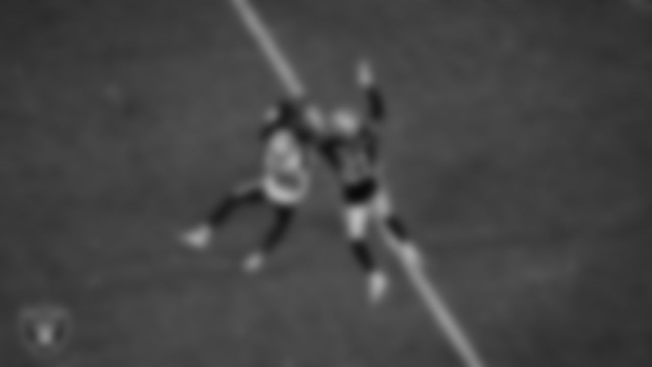 Las Vegas Raiders cornerback Amik Robertson (21) breaks up a pass during the regular season home game against the New England Patriots at Allegiant Stadium.