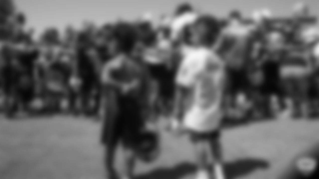 Oakland Raiders wide receiver Antonio Brown (84) signs autographs for fans after practice at 2019 Training Camp.