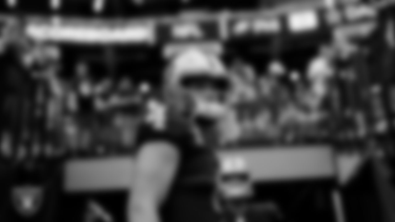 Las Vegas Raiders quarterback Derek Carr (4) walks down the tunnel before the regular season home game against the Miami Dolphins .