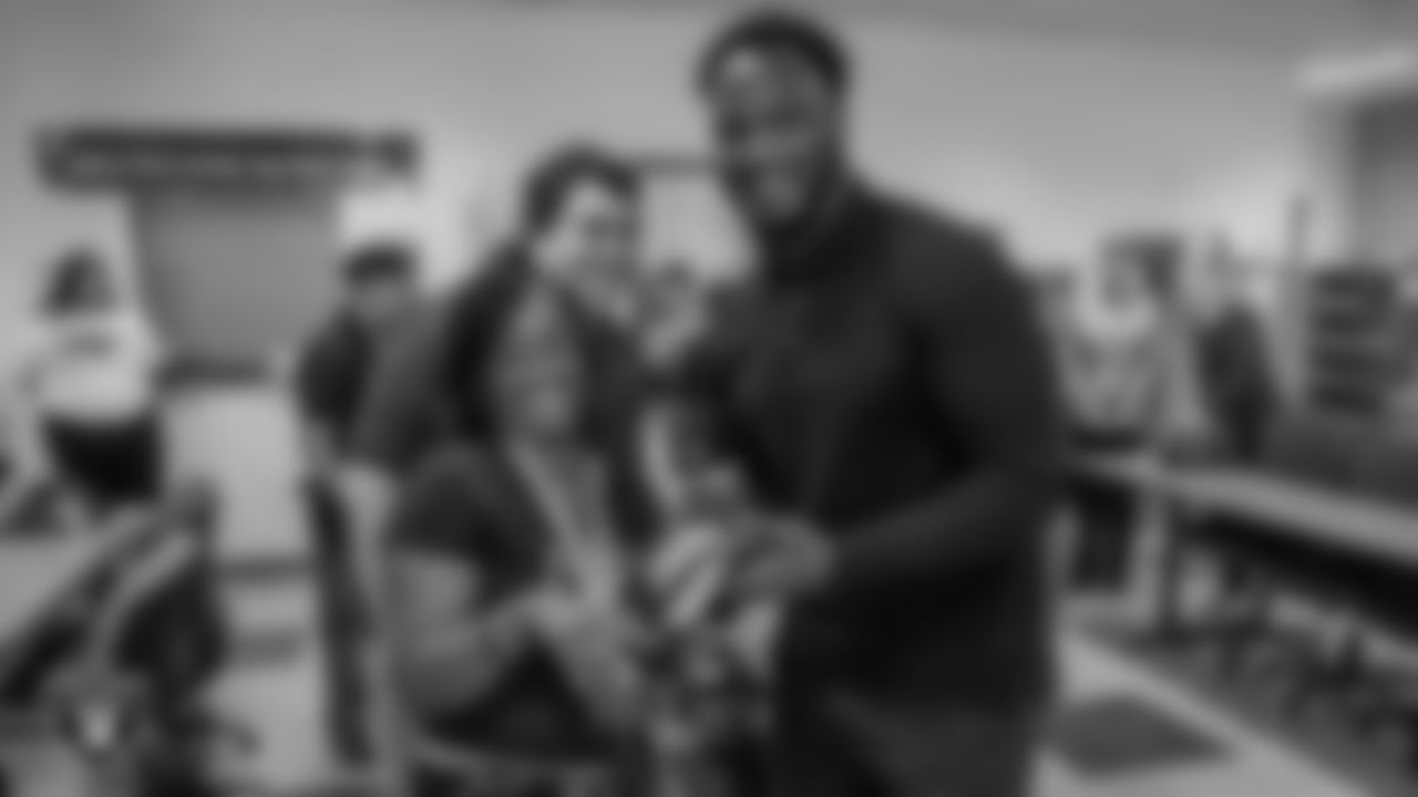 Las Vegas Raiders chief people officer Marcel Reece poses for a photo with members of the Las Vegas Metropolitan Police Department Northeast Area Command.