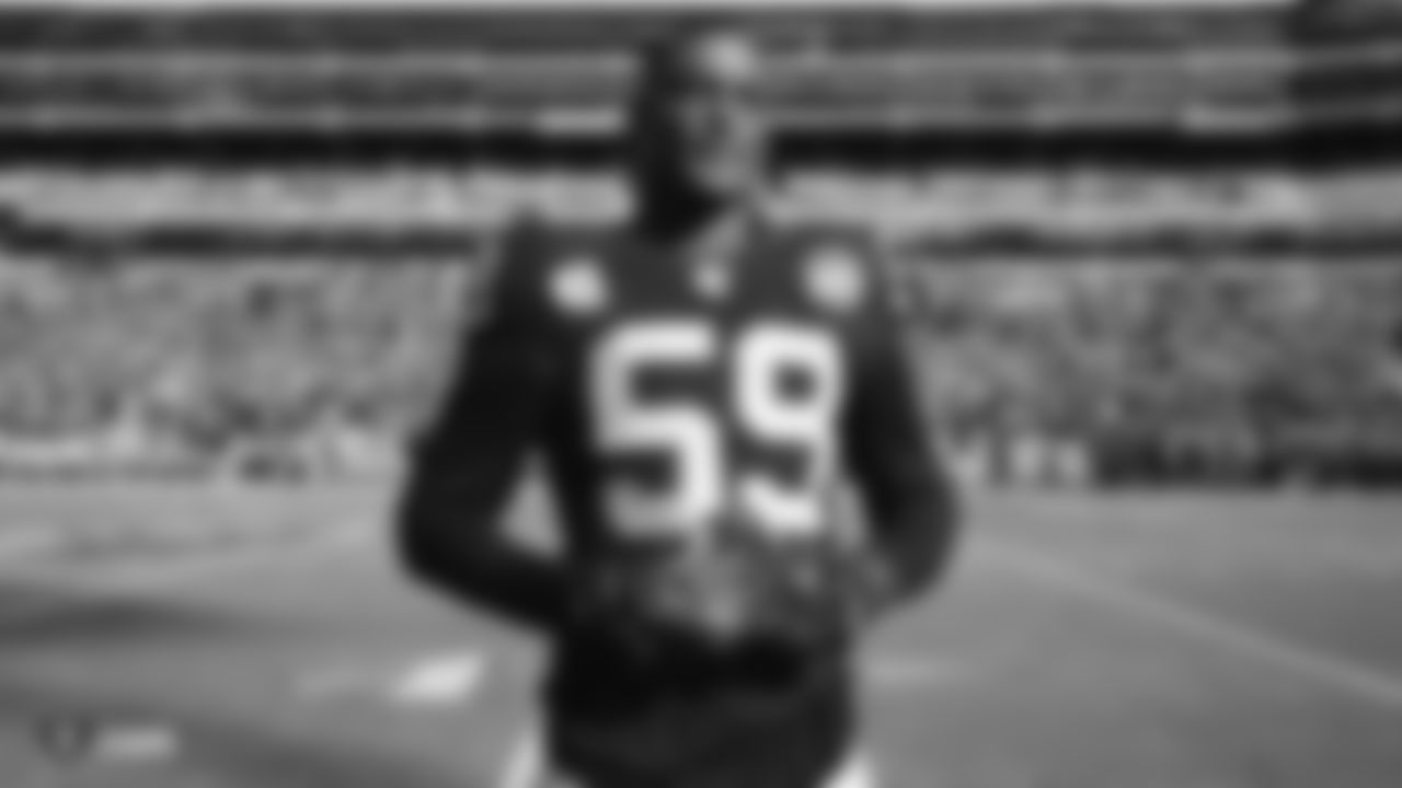 Raiders linebacker Tahir Whitehead is awarded the nomination as the Raiders' Walter Payton Man of the Award before the Raiders regular season game against the Jacksonville Jaguars.