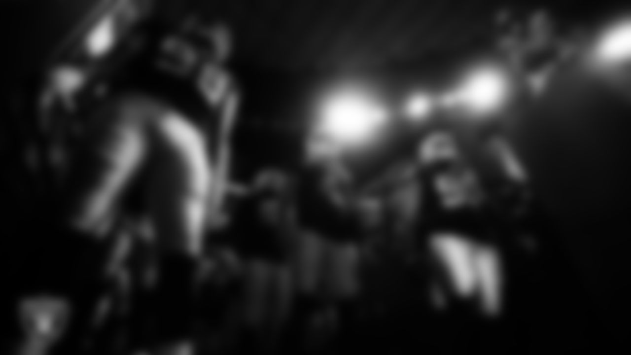 Las Vegas Raiders defensive end Maxx Crosby (98), quarterback Derek Carr (4) and defensive tackle Johnathan Hankins (90) wait to be introduced onto the field before the regular season home game against the Kansas City Chiefs.