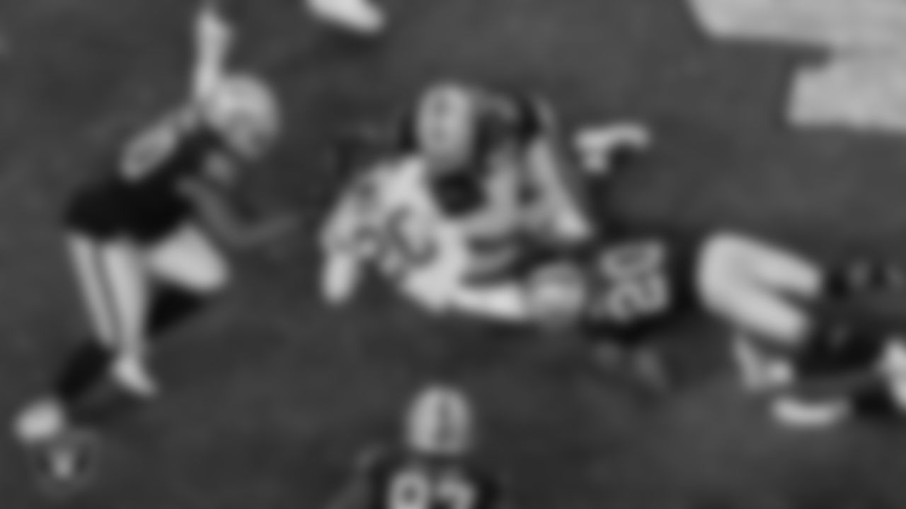 Las Vegas Raiders defensive tackle Johnathan Hankins (90), defensive end Maxx Crosby (98) and cornerback Damon Arnette (20) during the regular season game against the Kansas City Chiefs at Allegiant Stadium.
