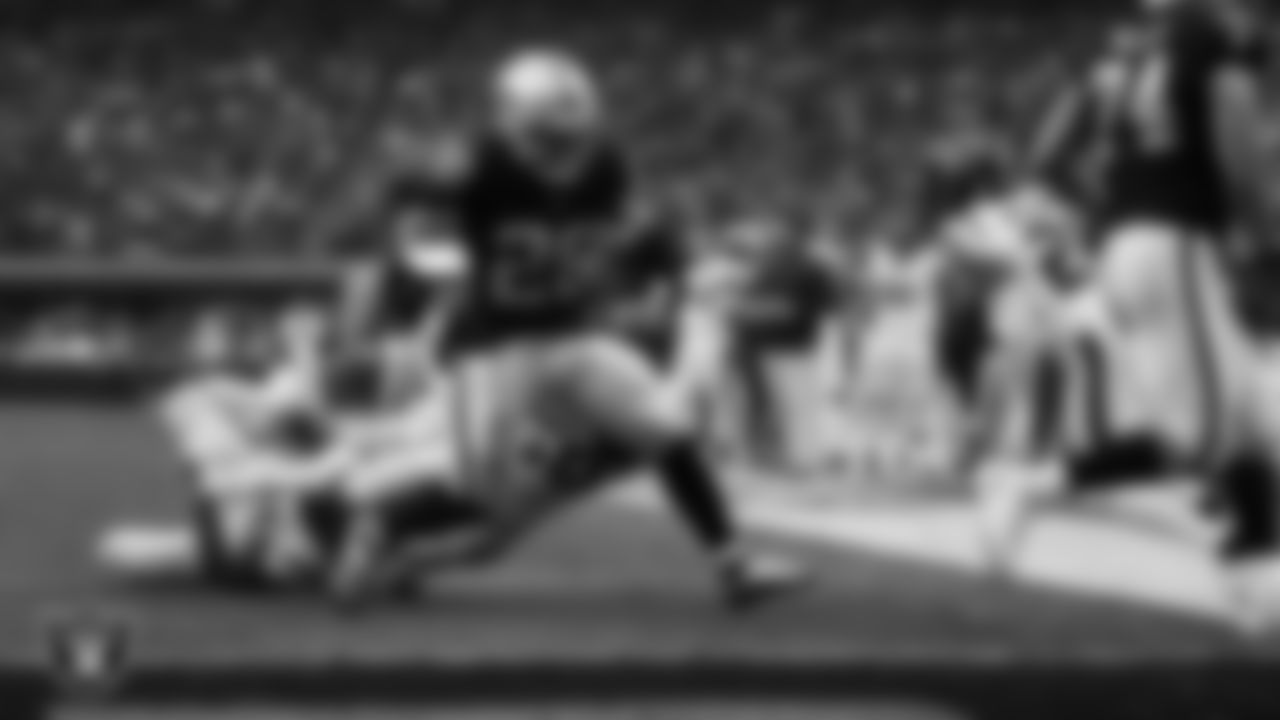 Las Vegas Raiders running back Josh Jacobs (28) rushes for a 4-yard touchdown during the regular season home game against the Houston Texans at Allegiant Stadium.