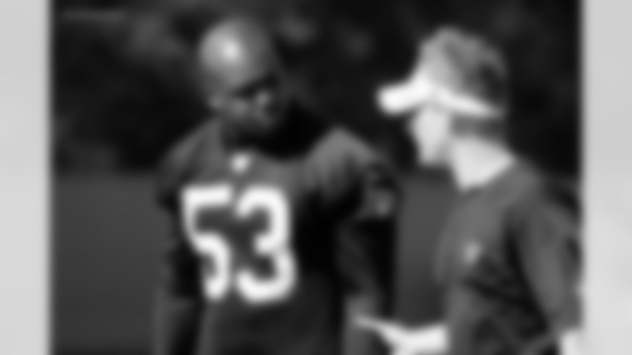 LB Carl Ihenacho listens to defensive coordinator Jason Tarver.