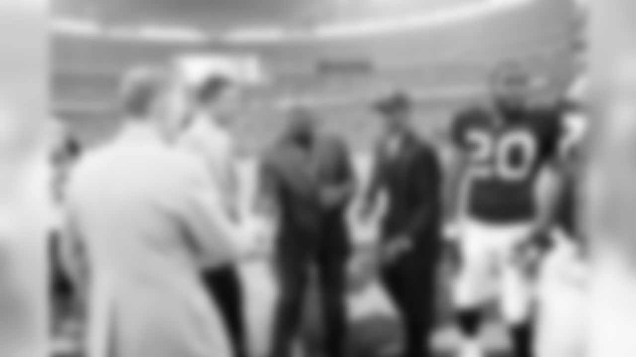 Dolphins honorary captains Dan Marino and Bob Griese with Raiders honorary captains Willie Brown and Tim Brown