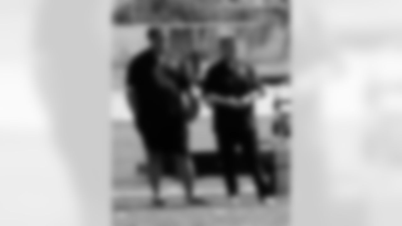 GM Reggie McKenzie and senior offensive assistant Al Saunders