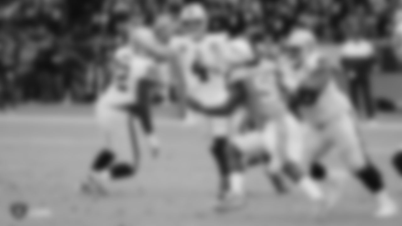 Raiders quarterback Derek Carr (4) passes as guard Gabe Jackson (66) blocks during the regular season game against the Los Angeles Chargers.