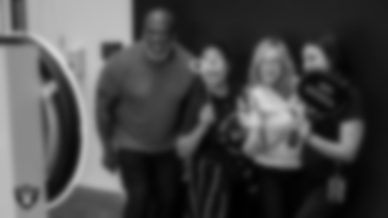 Las Vegas Raiders alumnus Roy Hart, office manager Dona Verner, store manager Erica Olive and front office receptionist Tlyssa Leyva pose for a photo during the B.A.S.E.D. in Sports Family Reunion at Intermountain Health Performance Center.