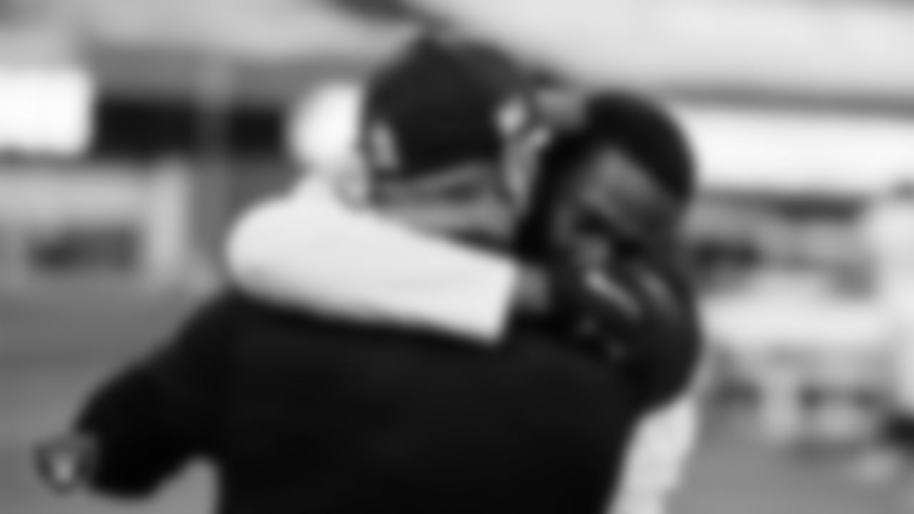 Las Vegas Raiders defensive backs coach Jim O'Neil and cornerback Isaiah Johnson (31) on the field after the regular season away game against the Los Angeles Chargers.