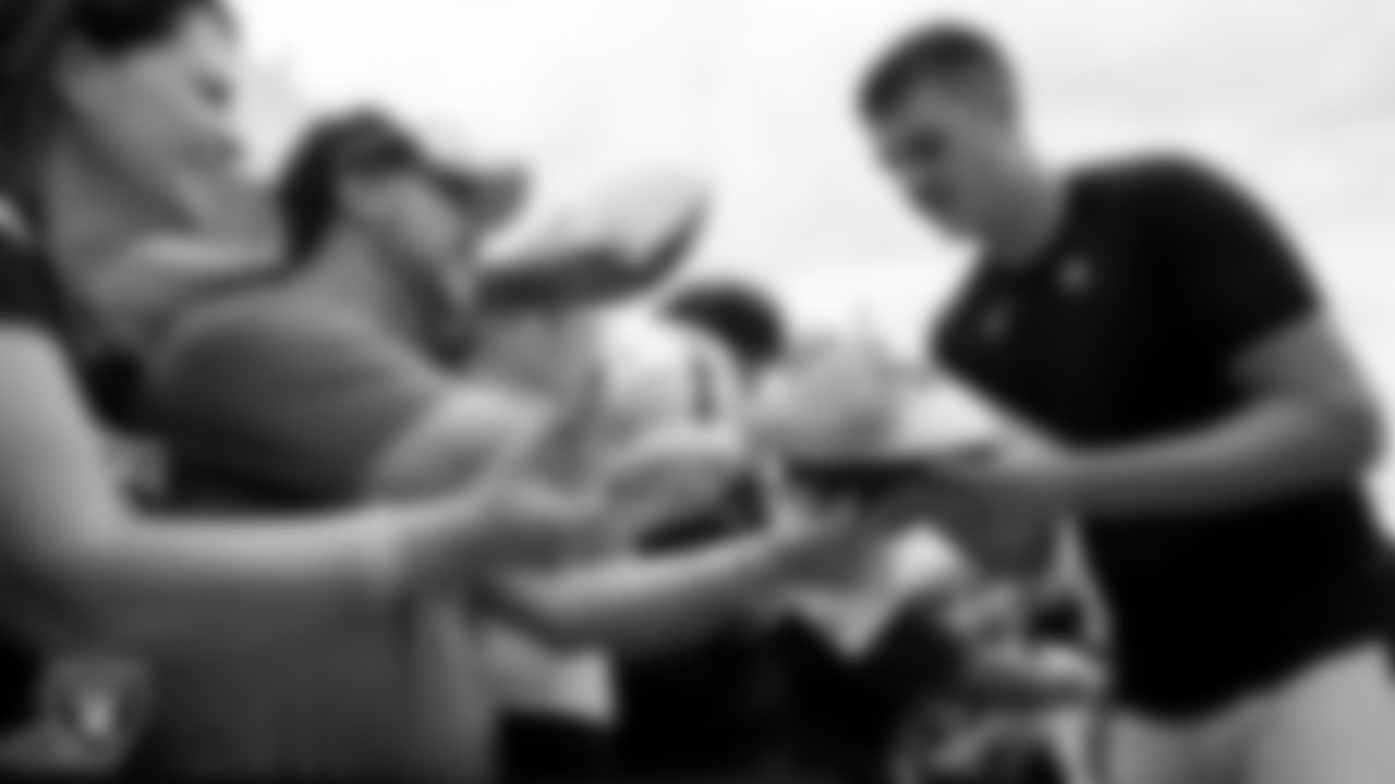 Las Vegas Raiders quarterback Aidan O'Connell (4) signs autographs for fans after practice at 2023 Training Camp at Intermountain Health Performance Center.