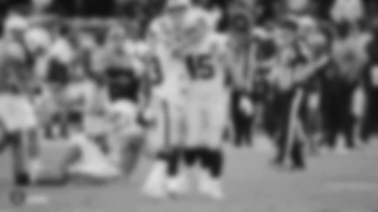 Raiders running back DeAndré Washington (33) celebrates with fullback Alec Ingold (45) after rushing for a game-ending first down during the regular season game against the Los Angeles Chargers.