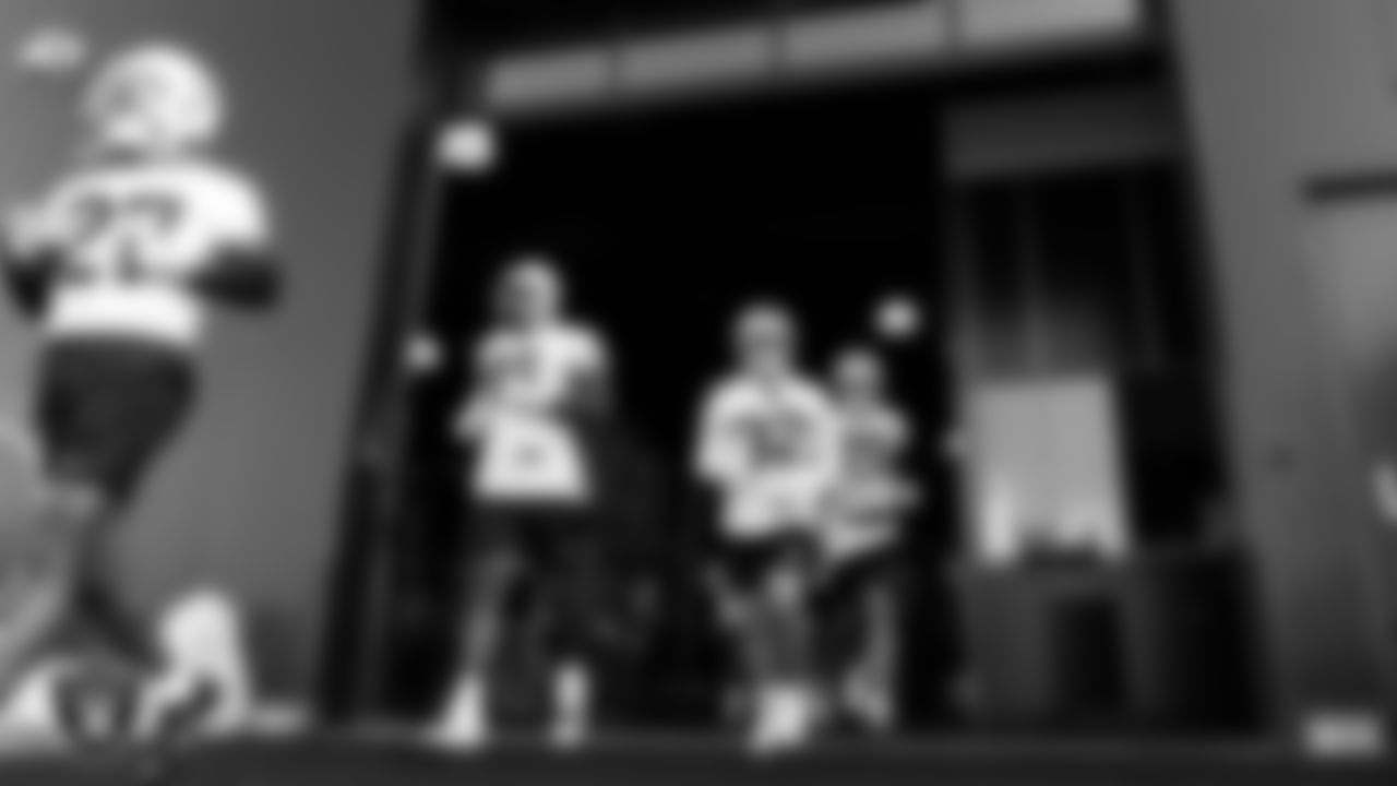 Las Vegas Raiders defensive end Clelin Ferrell (96), safety Dallin Leavitt (32) and safety Erik Harris (25) take the field for practice at 2020 Training Camp.