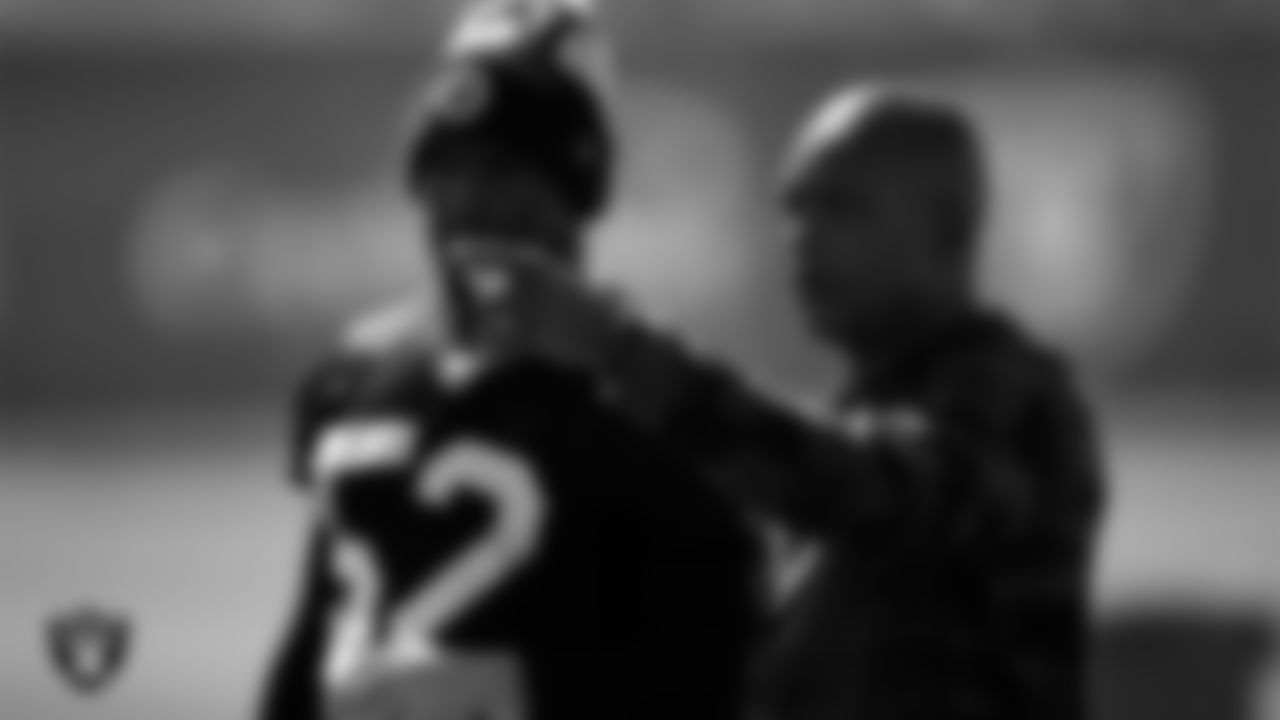 Las Vegas Raiders linebacker Denzel Perryman (52) and defensive backs coach Ron Milus during practice at Intermountain Healthcare Performance Center.