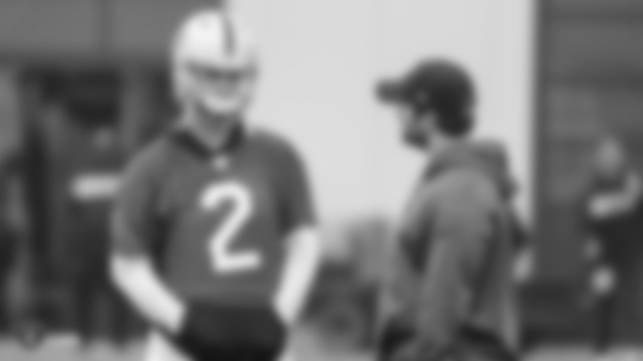Oakland Raiders quarterback AJ McCarron (2) and quarterbacks coach Brian Callahan on the field for practice at the Oakland Raiders Practice Facility, Friday, December 21, 2018, in Alameda, California.