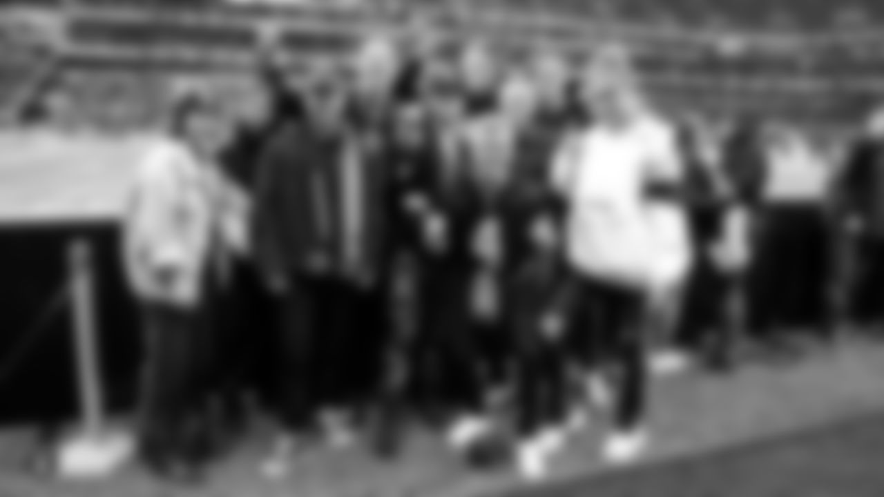 Model Josephine Skriver and musical artiest Alex DeLeon pose for a photo with friends before the Raiders regular season game against the Chicago Bears.