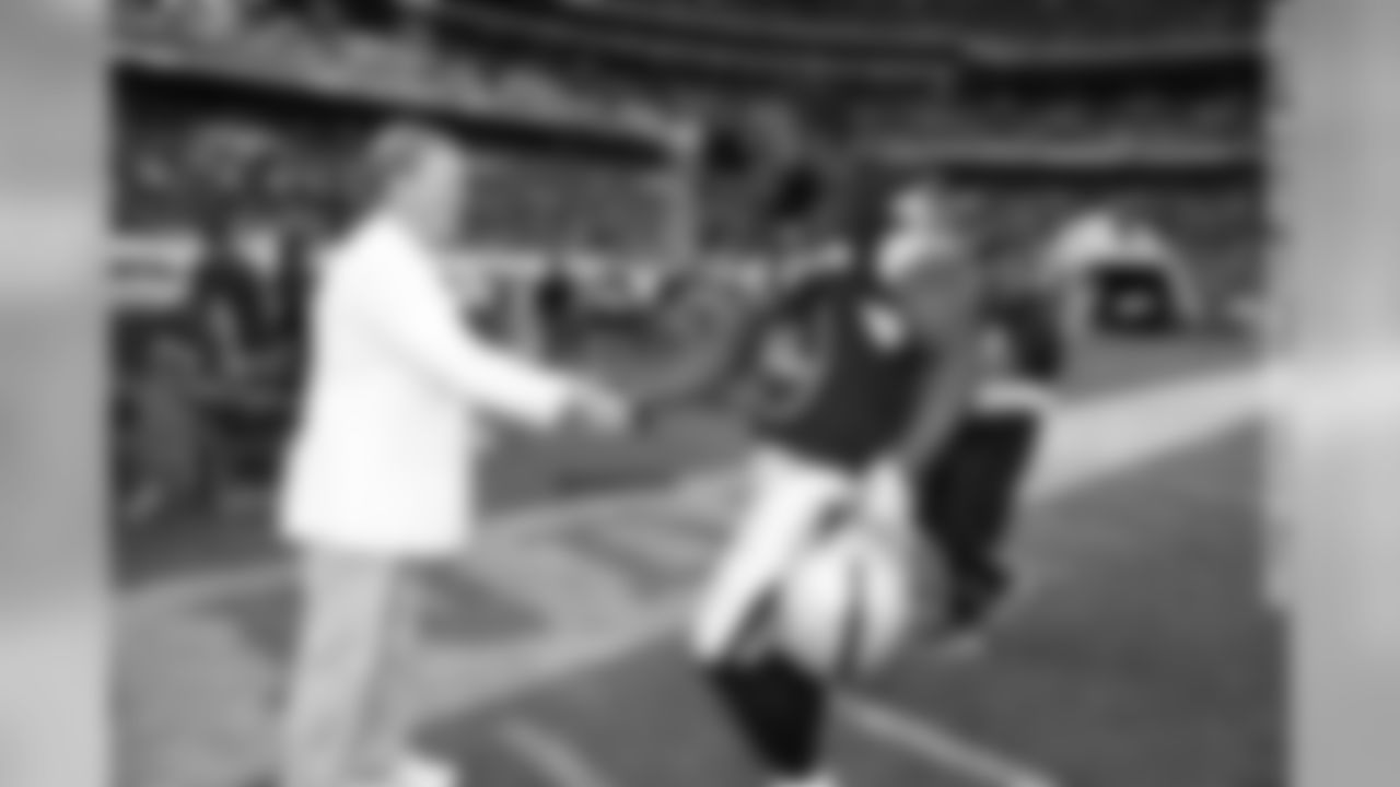 FB Marcel Reece comes over to say hello to owner Mark Davis.