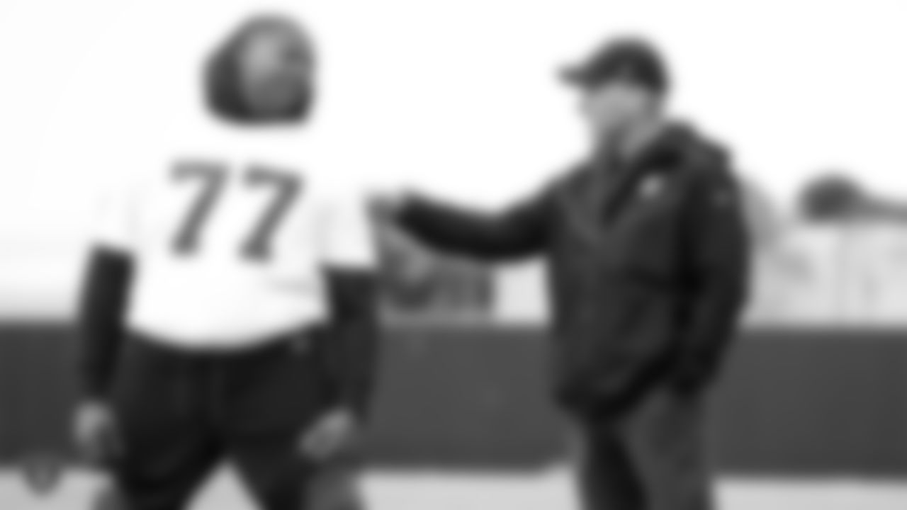 Raiders tackle Trent Brown (77) and general manager Mike Mayock at a workout during phase two of the offseason program at the Raiders Practice Facility in Alameda, Calif.