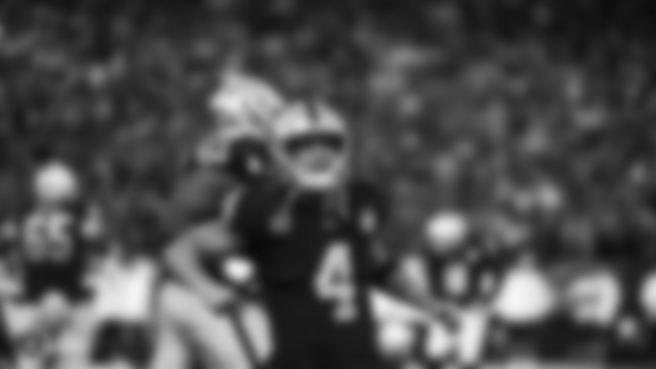 Raiders quarterback Derek Carr (4) celebrates after a touchdown during the Raiders regular season game against the Denver Broncos.