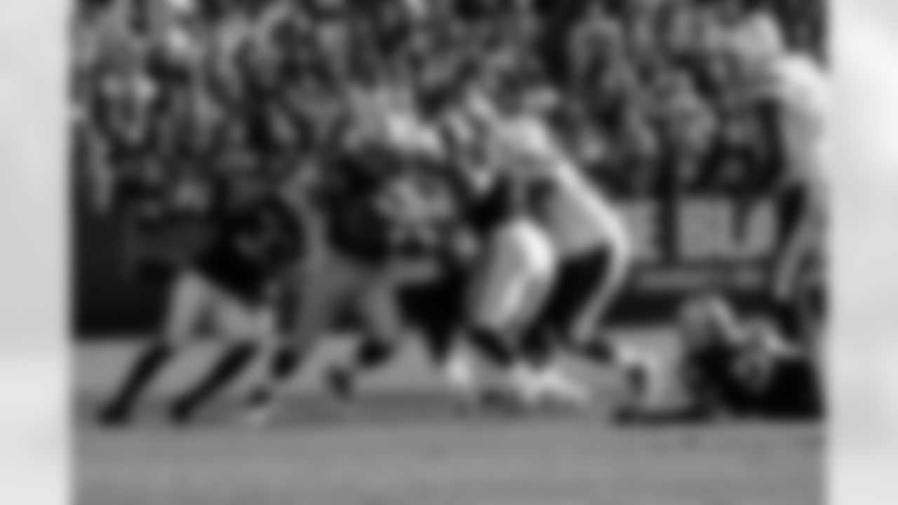 DE Desmond Bryant and DT Tommy Kelly make the tackle.